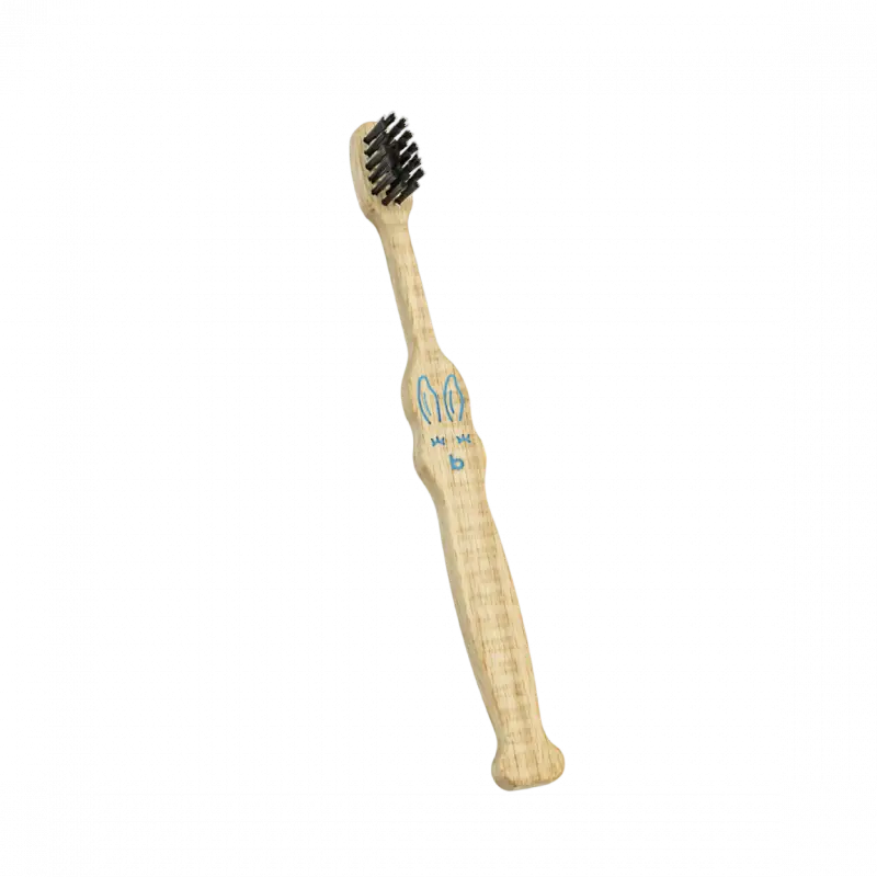 Brosse à dents enfant en bambou beige avec poils noirs, idéale pour plus jeune âge