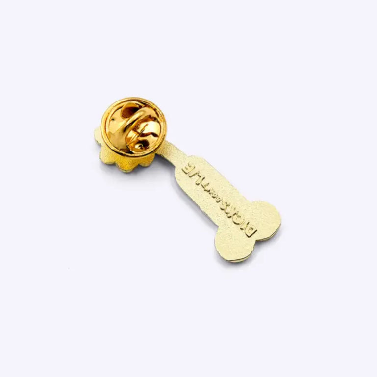 Pin en placage doré avec finition émaillée, brillance durable, forme os stylisé