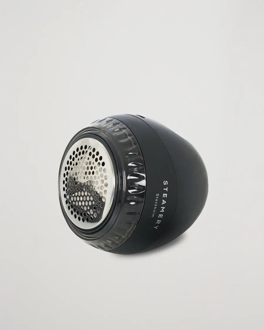 Rasoir anti-bouloche noir avec tête en maille métallique