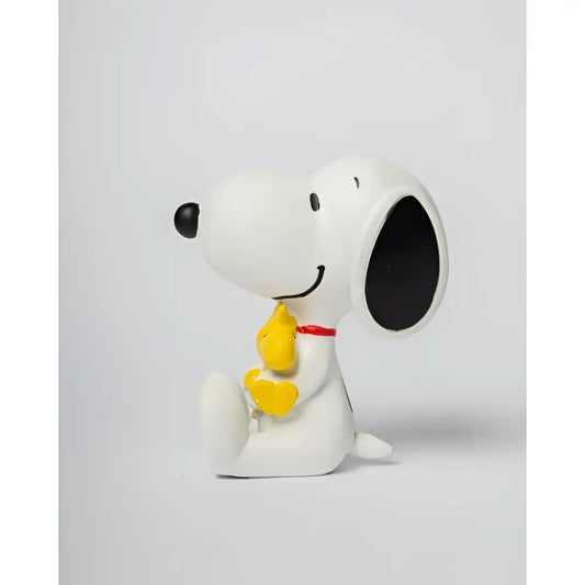 Statue Snoopy en blanc tenant Woodstock jaune, symbole d’amitié