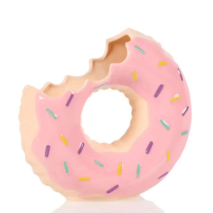 Pink donut avec une bouchée, colorée, parfait pour d’un donut flottant