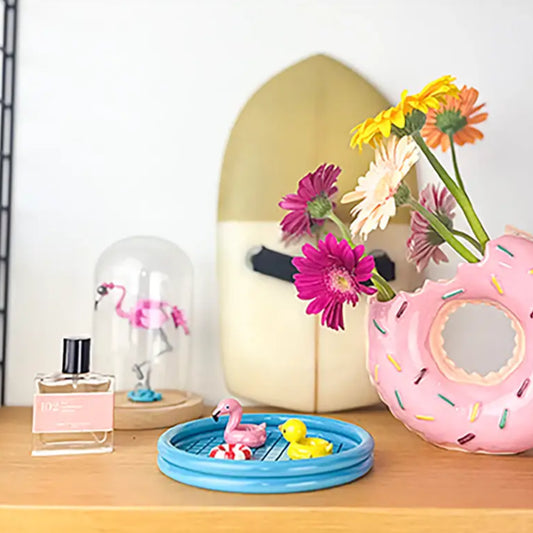 Vide poche floaty pool en forme de donut rose avec des sprinkles colorés, super mignon