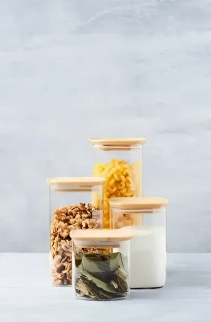 Quatre bocaux en verre borosilicaté avec couvercle en bambou hermétique, fruits secs