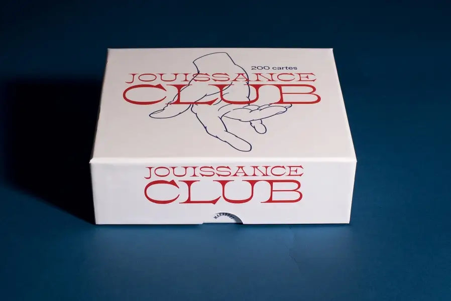 Boîte Jouissance Club blanche avec cartes intimes et main graphique