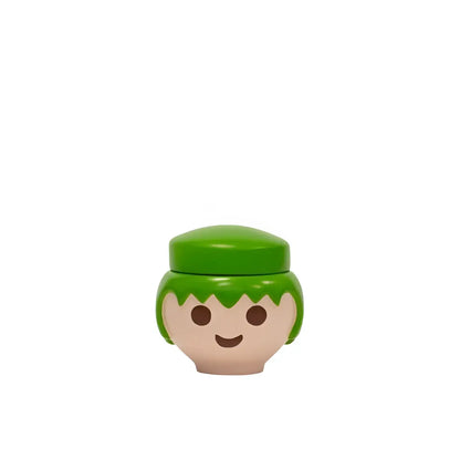 Tête figurine Playmobil style clin d’œil boîte verte design ludique