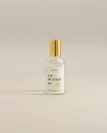 Bouteille en verre clair avec bouchon doré de Brume de linge 100 ml, fraîcheur naturelle