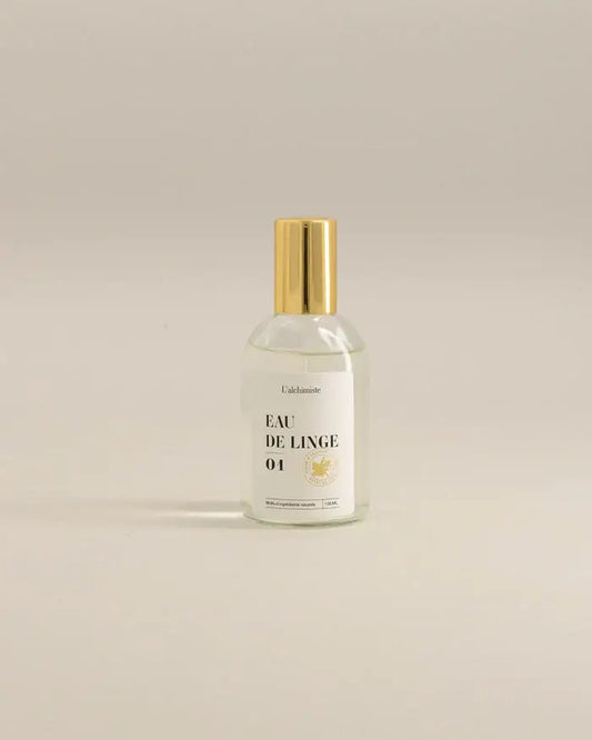 Bouteille en verre clair avec bouchon doré de Brume de linge 100 ml, fraîcheur naturelle