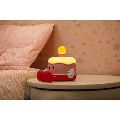Lampe nuit gâteau rose plush avec bougie jaune glow et pieds rouges pour ambiance douce