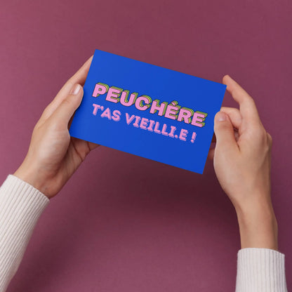Carte postale vibrante bleue Peuchère t’as vieilli.e par super équipe créative
