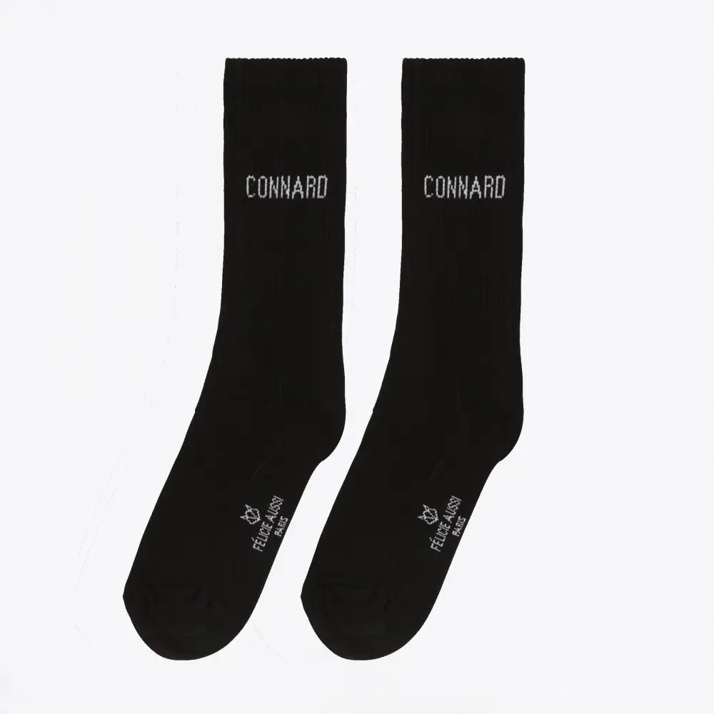 Chaussettes connard noires avec clin d’œil au mot connard sur cheville