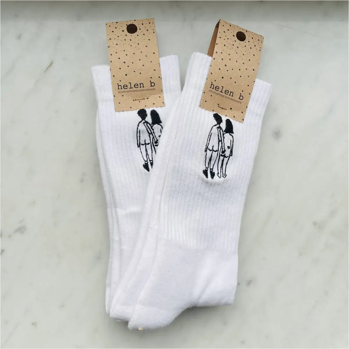 Chaussettes naked couple en blanc avec broderie signature d’un couple nu humoristique