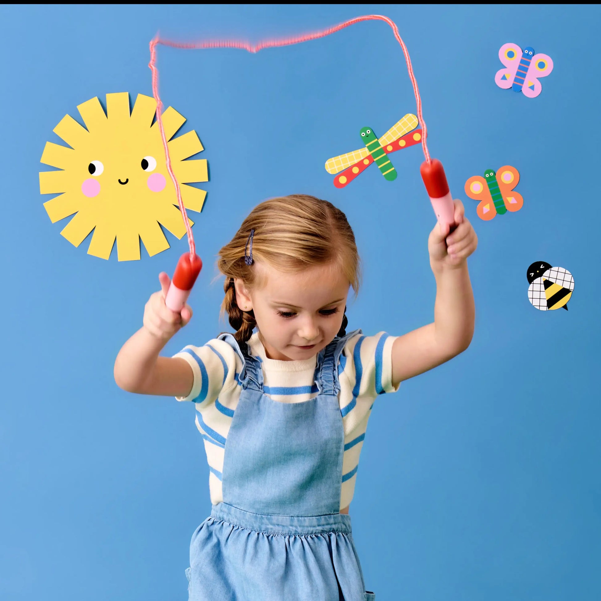 Corde à sauter Kidoki design ludique rose avec poignées rouges