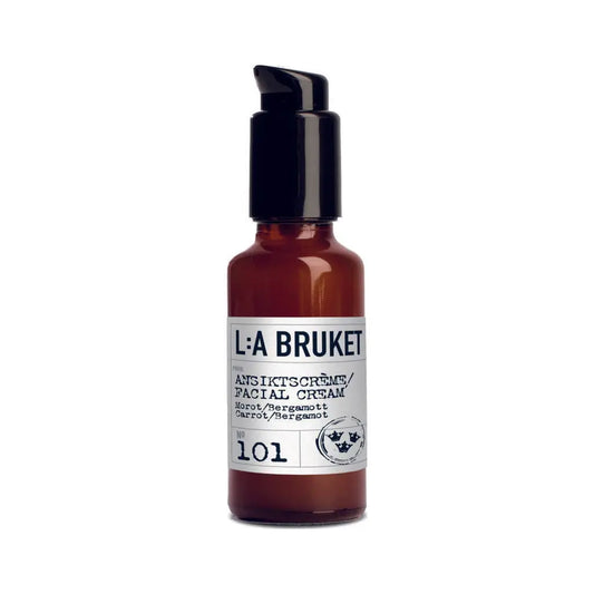 Flacon pompe marron de crème légère visage carotte bergamote