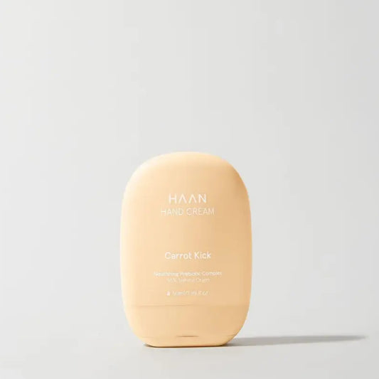 Tube de crème pour les mains rechargeable Carrot Kick, couleur pêche, pratique et stylée