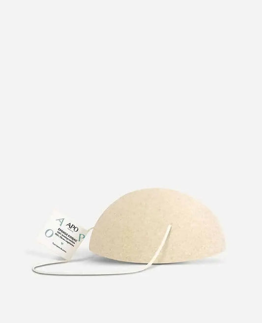 Éponge konjac beige semi-circulaire pour routine beauté zéro déchet