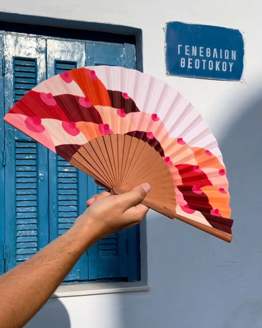 Eventail Sahara au design audacieux en vagues roses et orange