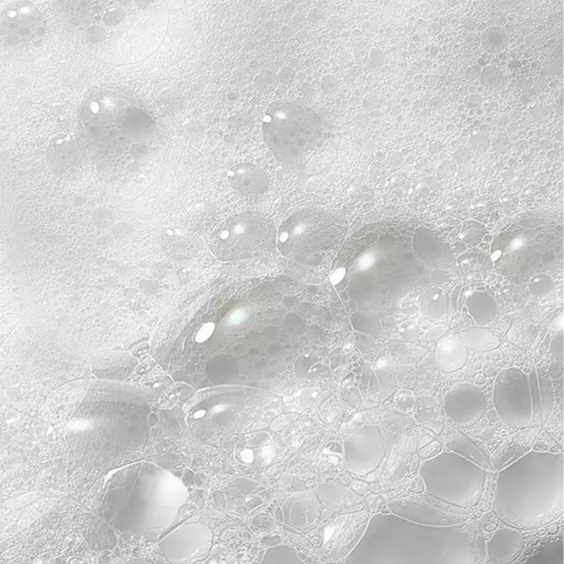 Gel douche hydratant aux probiotiques avec mousse blanche et sphères translucides