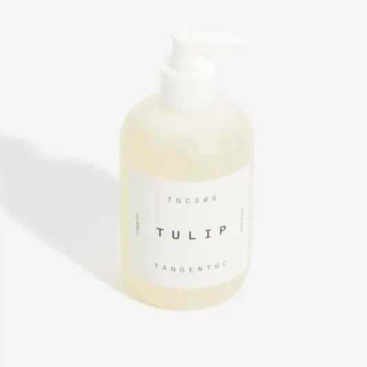 Gel douche bio Tulip 350 mL avec bouteille blanche et liquide jaune pâle