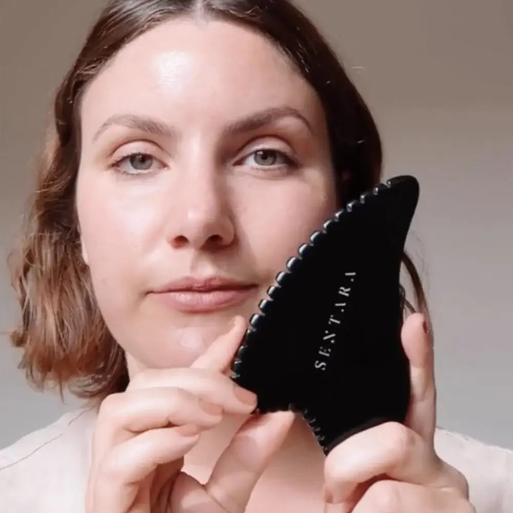 Outil gua sha peau d’ange corps en pierre naturelle noire ondulée