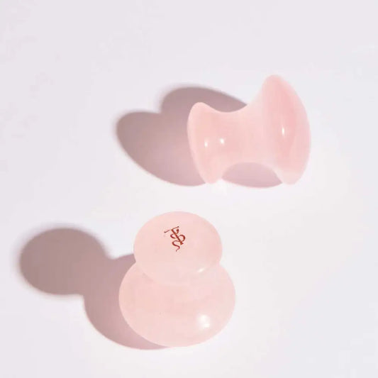 Deux outils Gua Sha Quartz Rose Magic Mashroom en quartz rose pour le soin facial