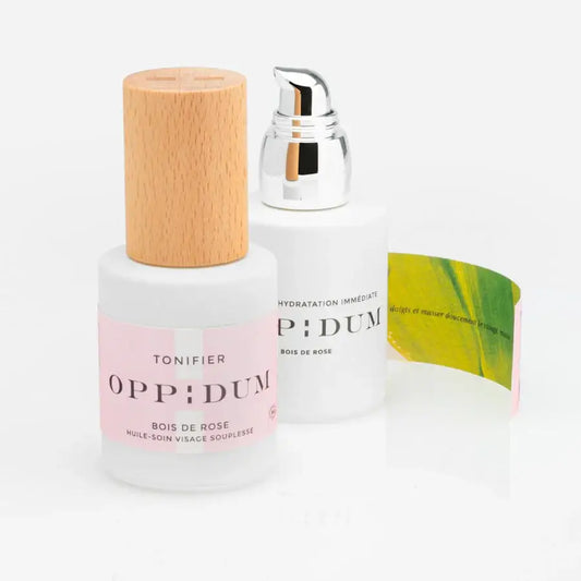 Huile soin visage et corps Hydratation bois de rose en bouteilles blanches avec bouchons en bois et argent