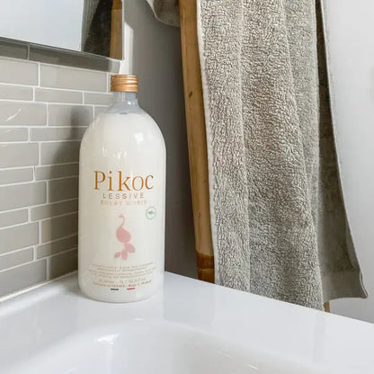 Bouteille blanche Lessive Eclat d’Iris 1L, formule innovante d’origine naturelle
