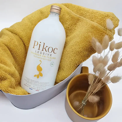 Bouteille blanche de lessive oranger en fleurs 1L, formule respectueuse