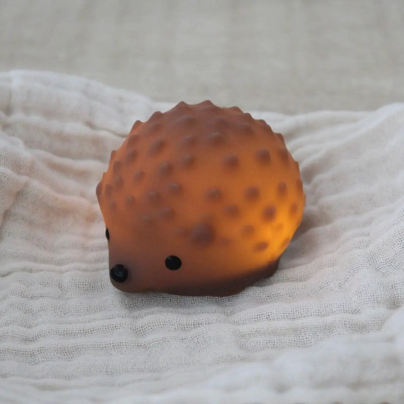 Mini veilleuse hérisson rechargeable orange translucide avec yeux et nez noirs