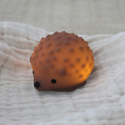 Mini veilleuse hérisson rechargeable orange translucide avec yeux et nez noirs