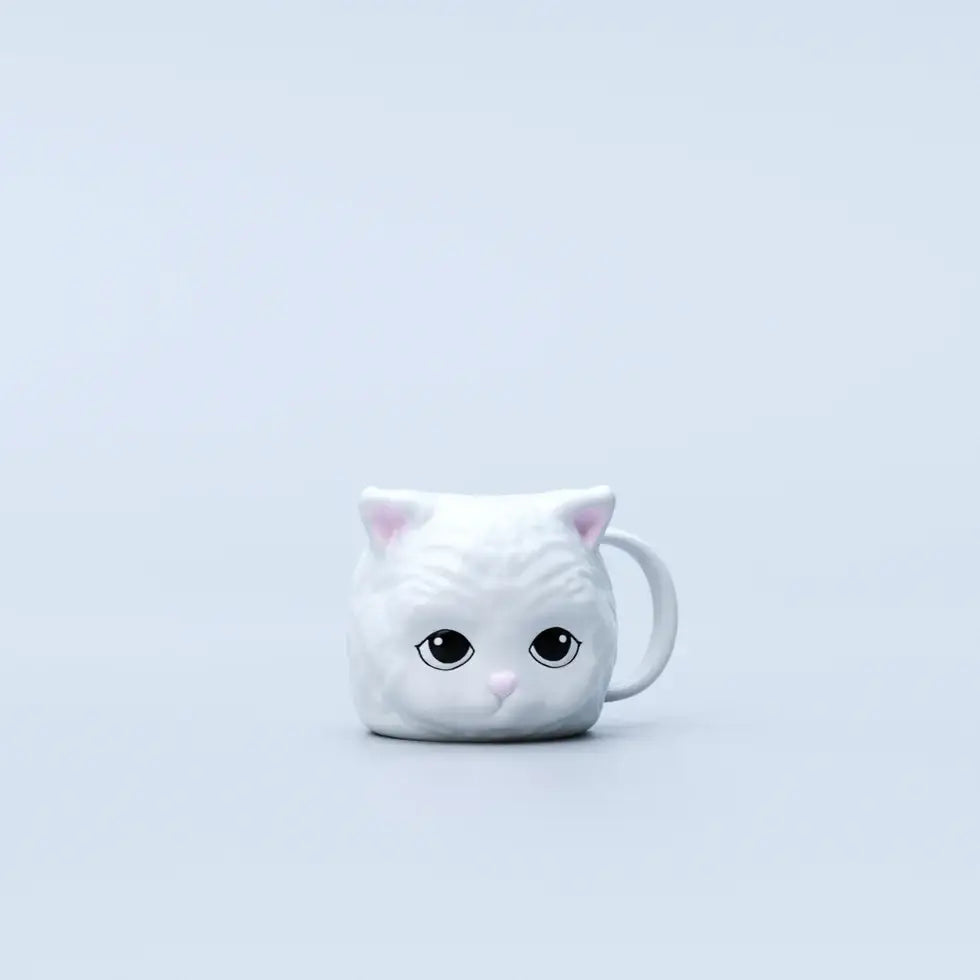 Mug en céramique motif chat blanc avec oreilles et nez roses, touche ludique