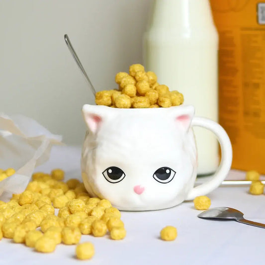 Mug tête de chat en céramique motif chat, débordant de puffs jaunes, touche ludique