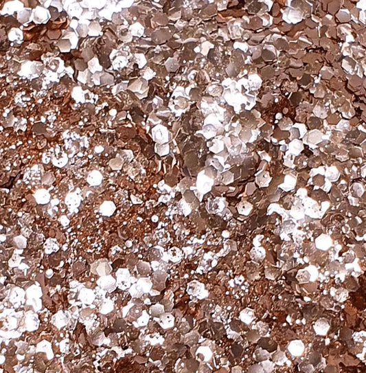 Tas de paillettes vegan Tchin Tchin en or rose, paillettes mixtes hexagonales et rondes, engagement écologique pour maquillage scintillant
