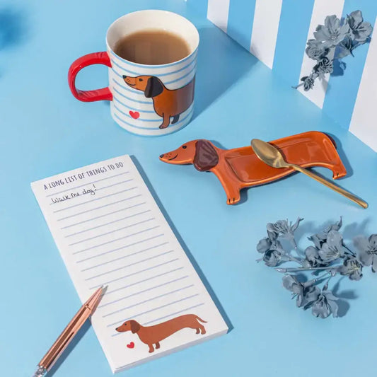 Petit vide poche teckel en céramique orange brillant avec cuillère dorée