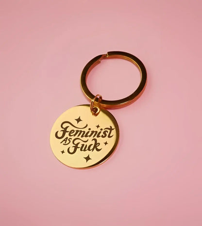 Porte-clé féministe as fuck en acier inoxydable doré