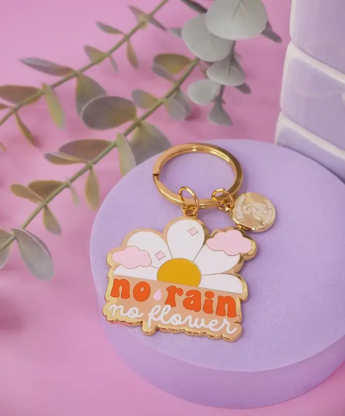 Porte-clé inspirant No Rain No Flowers avec détails dorés, idée cadeau