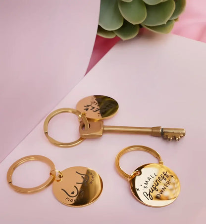 Porte-clé Survivor en inoxydable doré avec pendentifs circulaires