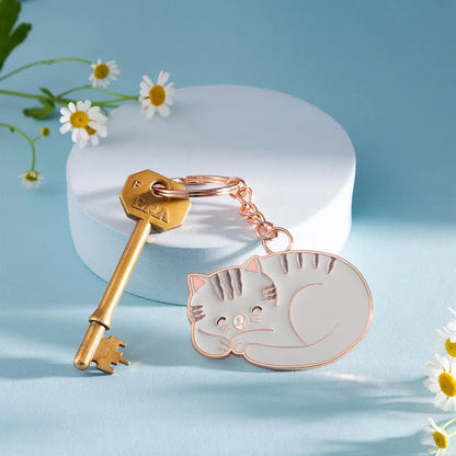 Porte-clés chat en or rose avec chat endormi mignon