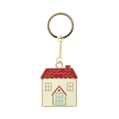 Porte-clés maison charmant en émail avec toit rouge, murs crème et porte bleue à cœur