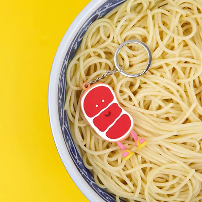 Porte-clés Ramen Gyū Sensei : tranche de viande rouge cartoon avec jambes roses et chaussures jaunes