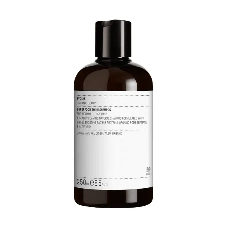 Shampoing brillance Evolve Organic Beauty en bouteille ambrée pour cheveux secs