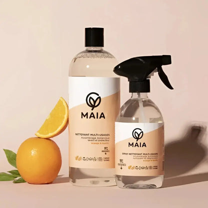 Deux bouteilles de nettoyant multi surfaces orange et basilic, avec spray et bouchon, orange entière et tranche