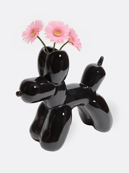 Vase sculptural Bobby chien ballon céramique noir glossy avec design épuré et gerbera roses
