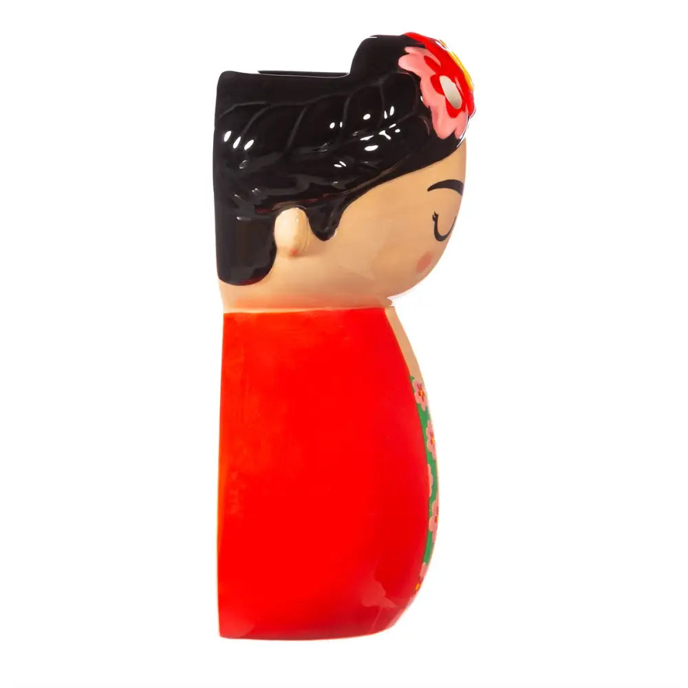 Cache-pot mural Frida Kahlo en forme de figure stylisée avec fleur rose et jaune