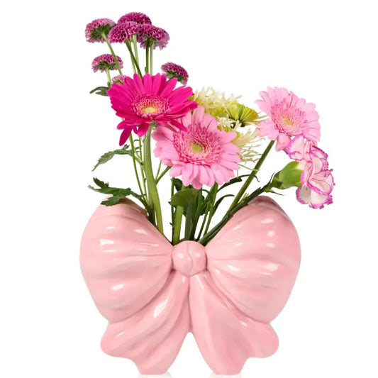 Vase noeud rose avec fleurs roses, fuchsia et vert pour une expérience unique