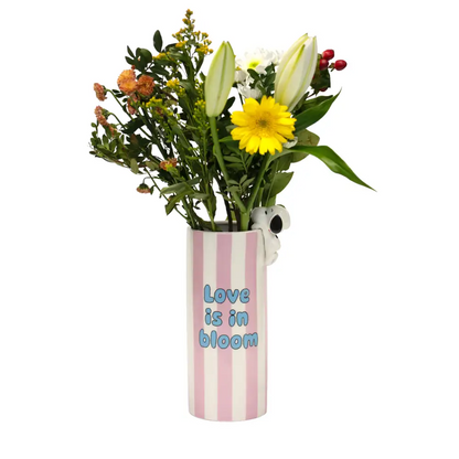 Jarrón rosa con el amor de Snoopy en flor