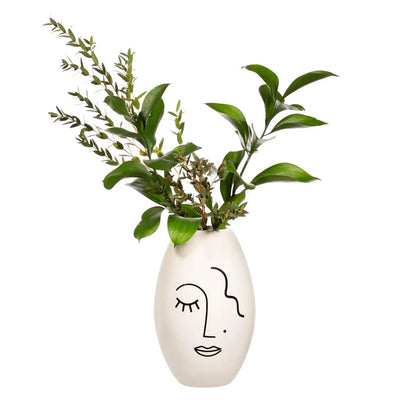Vase Visage Abstrait en céramique blanche avec visage minimaliste et boutures vertes pour décoration florale