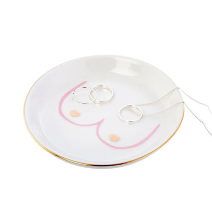 Vide poche boobs en céramique blanche à bord doré et motif sein rose, design minimaliste